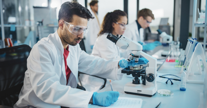 Scientists conducting an experiment in a lab