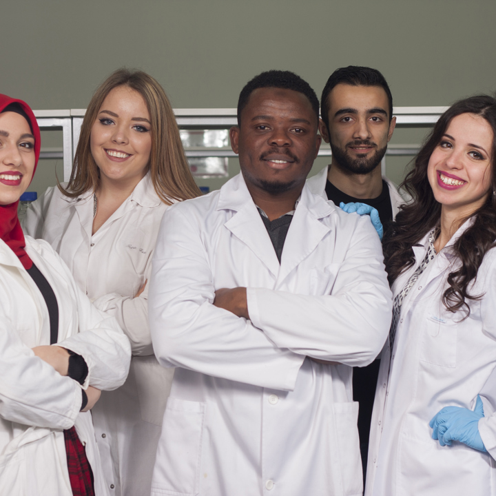Images of scientists working in a lab and students working 