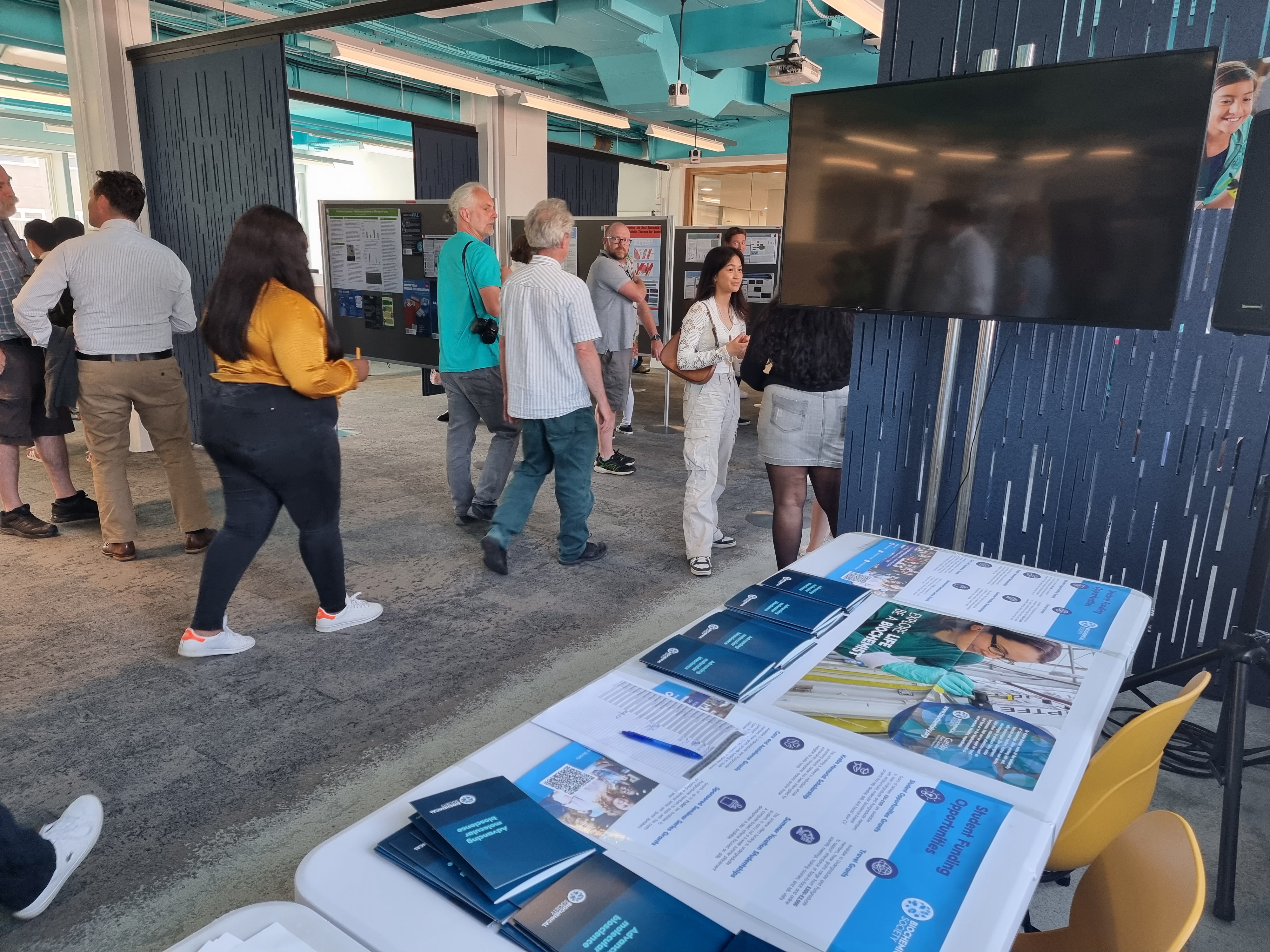 Biochemical Society flyers displayed on a table at an event