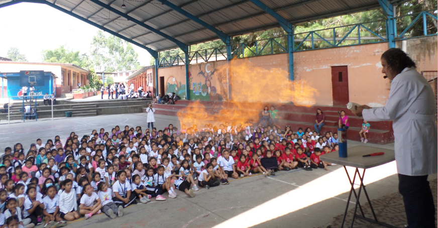 Students enjoying a science experiment performed by Doctor Demo