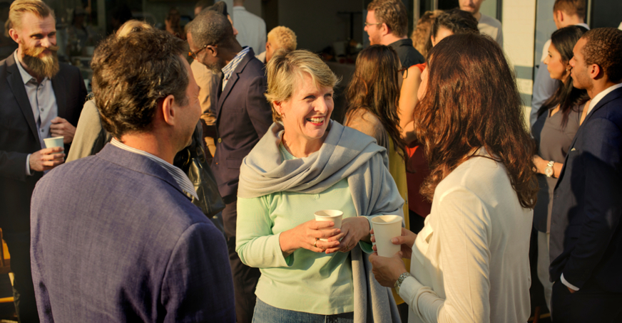 Members chatting at an event.