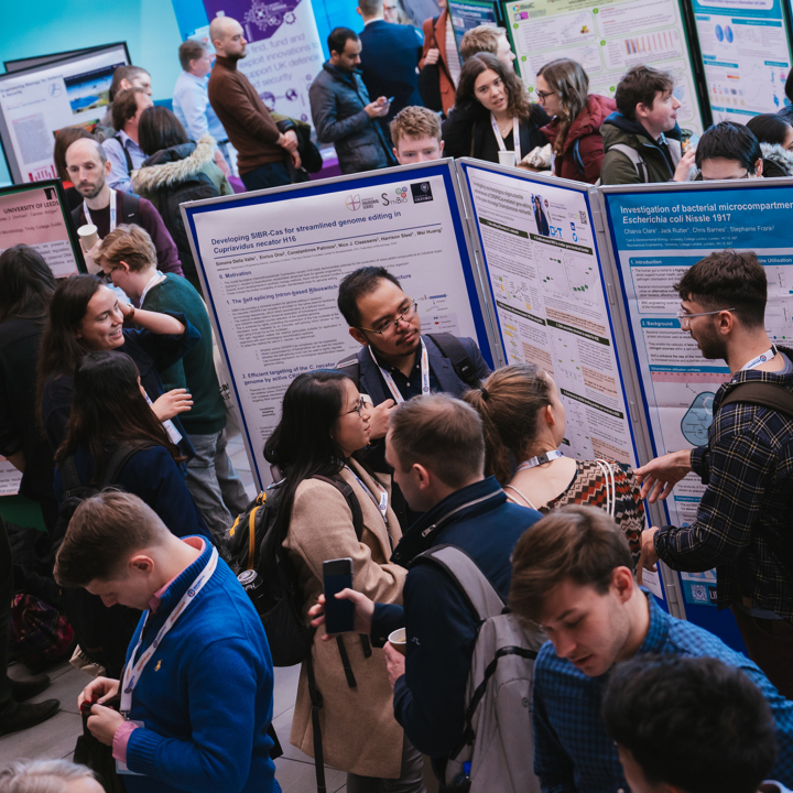 People networking during a Biochemical Society conference poster exhibition