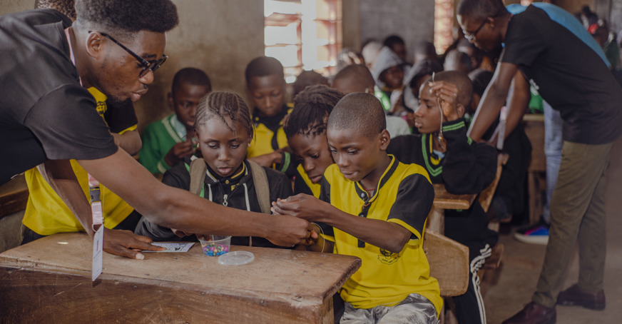 Group of children engaging with an outreach activity