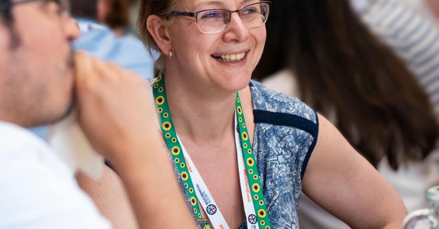 Full member having a conversation at a conference