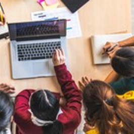 Images of scientists working in a lab and students working 