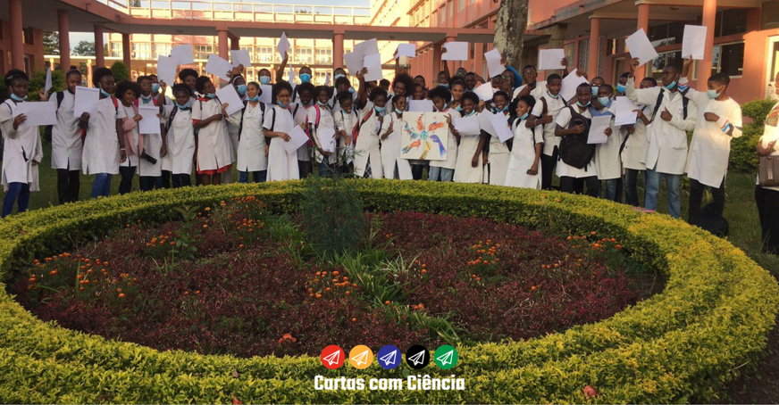 Students holding letters