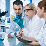 Group of 3 scientists in a lab conducting research