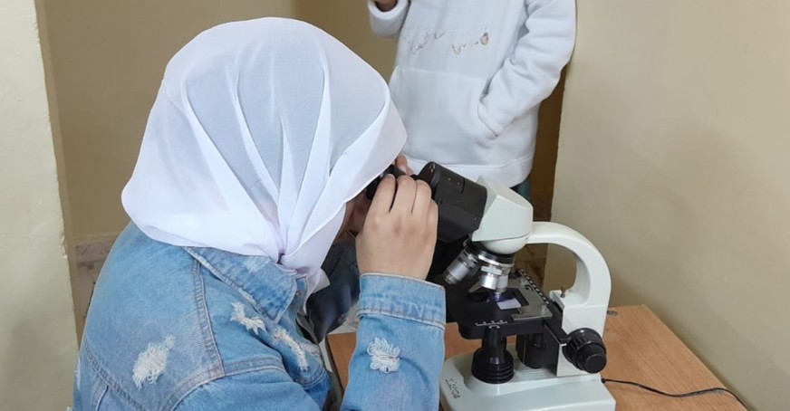 Woman using a microscope