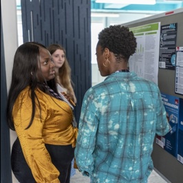 Group of students discussing their work