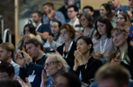 Group of event delegates watching a lecture at a scientific meeting