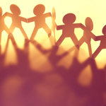 Paper doll people holding hands
