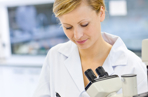 Scientist recording experiments in the lab.
