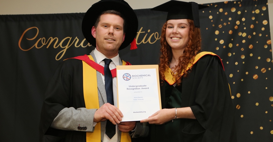Student receiving an Undergraduate Recognition Award at a graduation ceremony