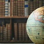 World globe against a backdrop of old books