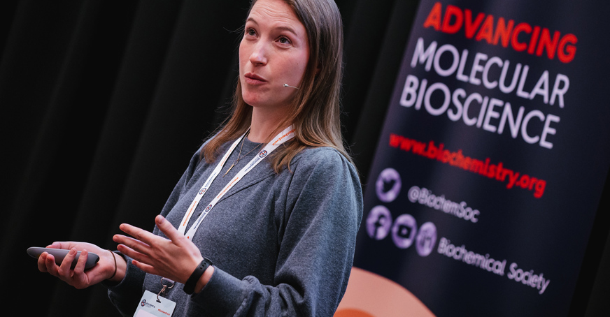Early career member giving a talk at a conference