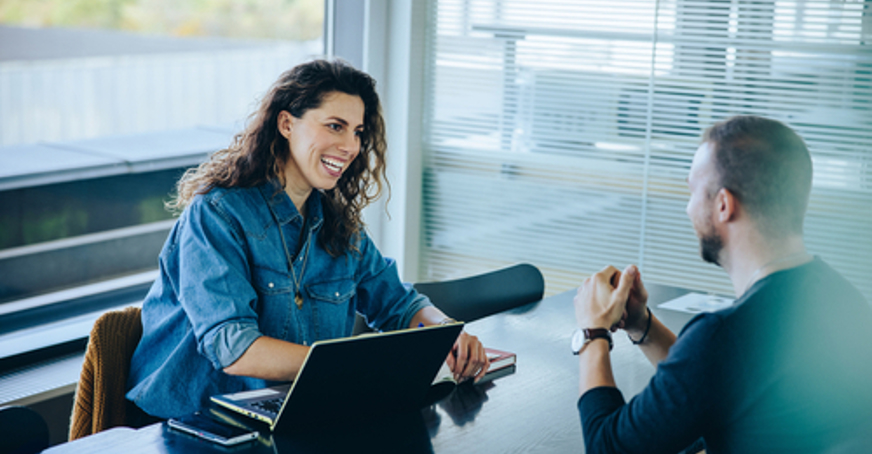 Woman and man having an interview in an office