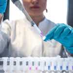 Scientist in a laboratory analysing clinical samples