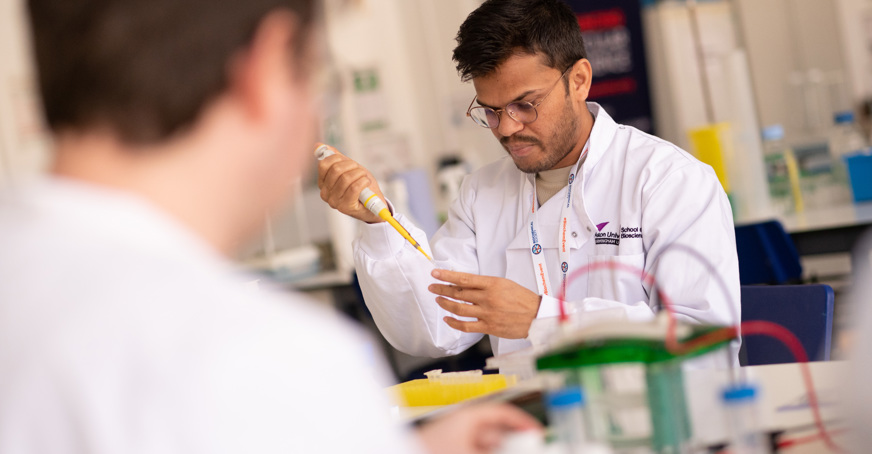 Scientist pipetting in the lab