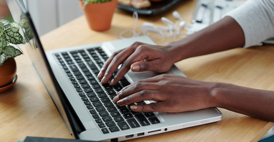 Person typing on a laptop