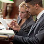 Two lawyers looking at paperwork