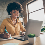 A woman sat at her laptop doing online training