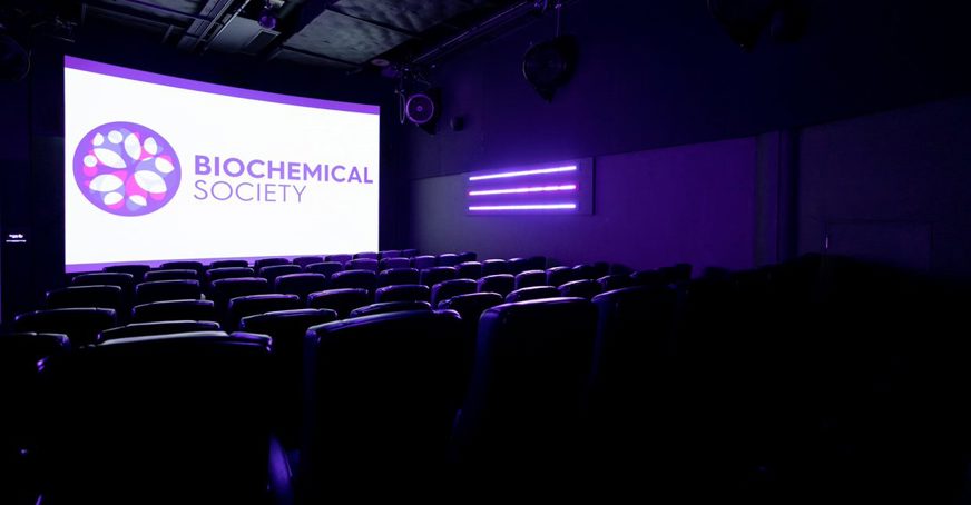 Empty conference room with Biochemical Society logo on the screen