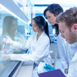 Senior scientist supervising a lab project.